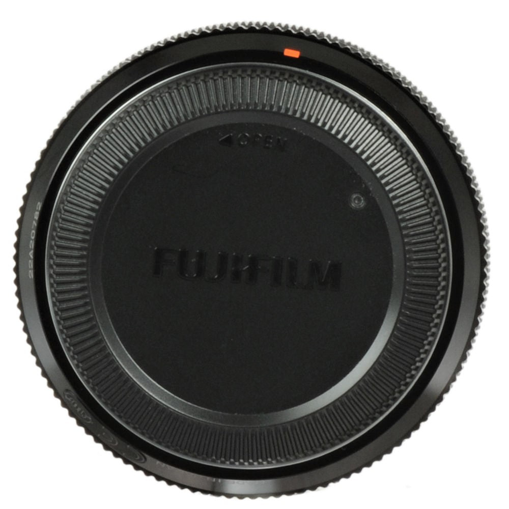 This image shows the front cap of the Fujifilm XF 35mm F1.4 R lens. The cap is black with the "FUJIFILM" logo in white at the center. The edges of the cap feature ridges for improved grip.