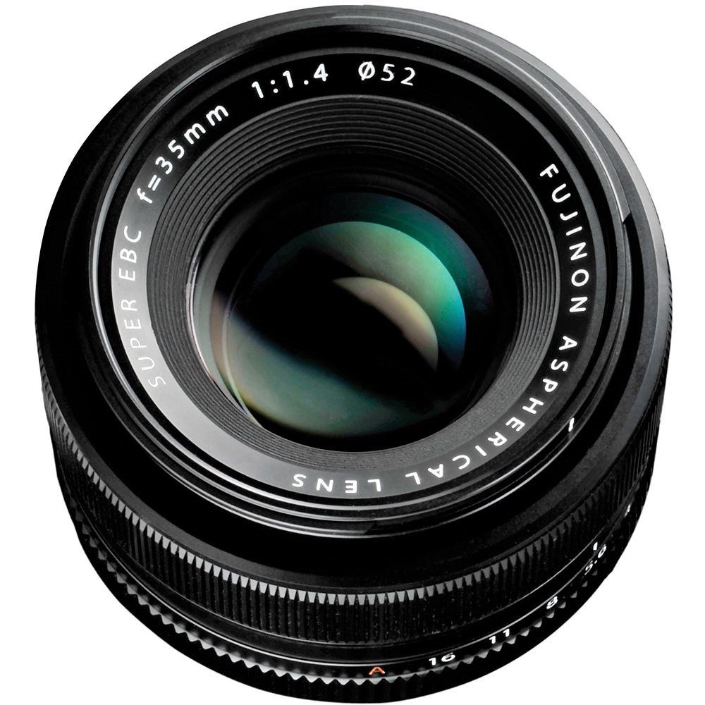 This image features a side view of the Fujifilm XF 35mm F1.4 R lens, showing its focus ring and depth of field scale. The focus ring has focal length markers in white, and the aperture ring shows red numbers from f/1.4 to f/16.